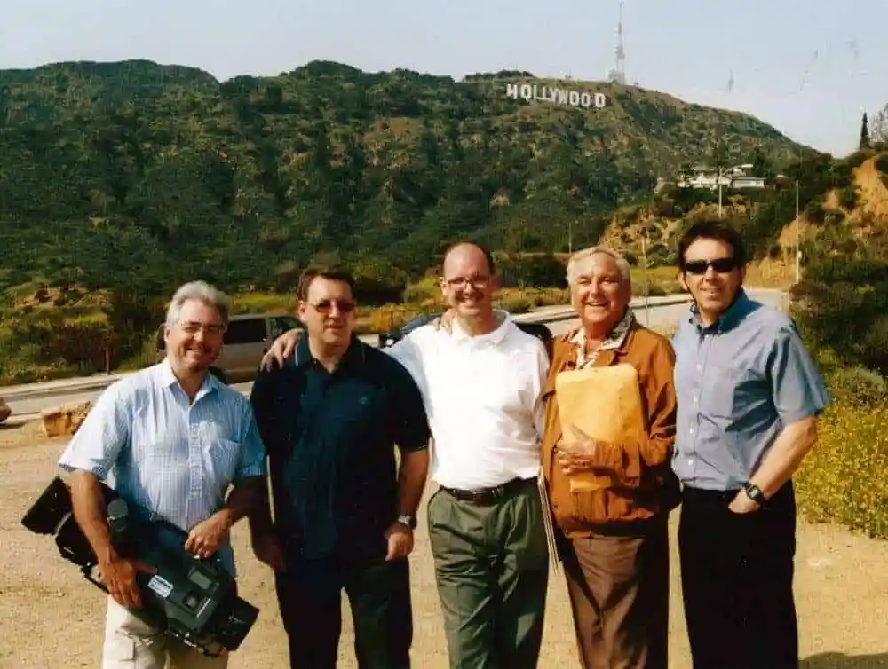 The production crew with Bob Monkhouse beneath the Hollywood sign