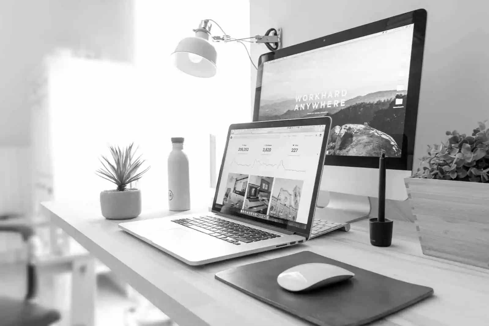 A laptop and monitor on a tidy, well-organised desk